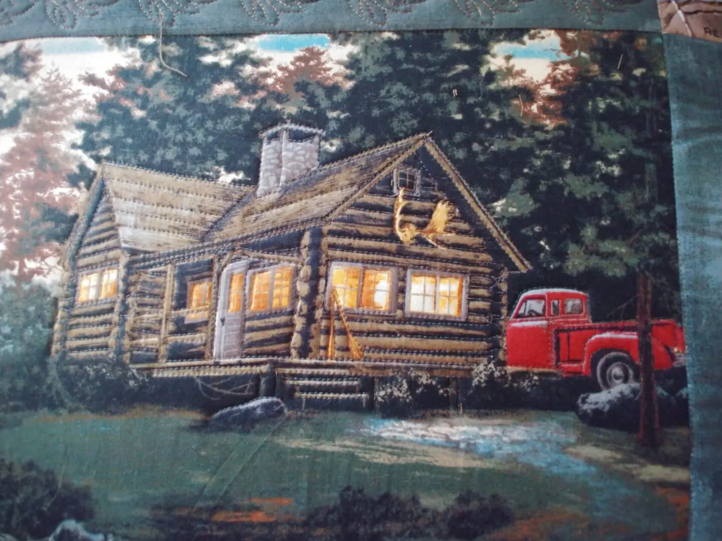 A painting of a log cabin and red truck.