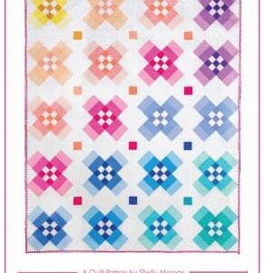 A quilt with different colored squares and flowers.