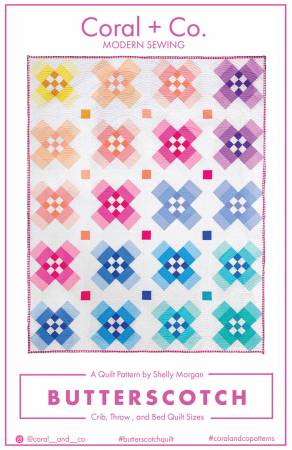 A quilt with different colored squares and flowers.