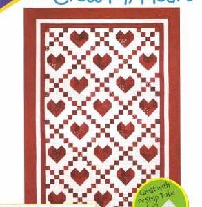 A quilt pattern with hearts and squares on it.