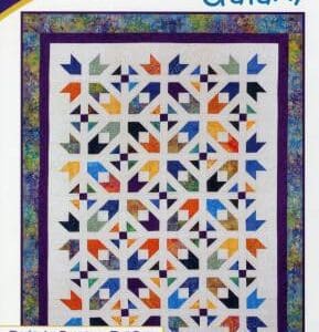 A quilt with colorful leaves and flowers on it.