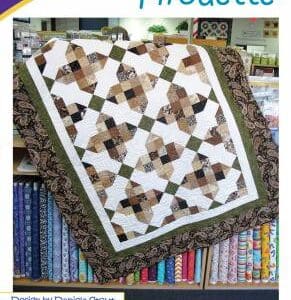 A quilt sitting on top of a table.