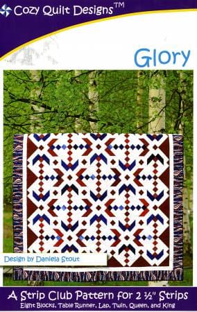 A quilt with red, white and blue designs on it.
