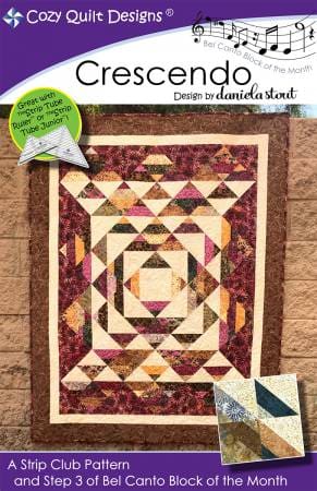 Crescendo quilt pattern with concentric geometric blocks