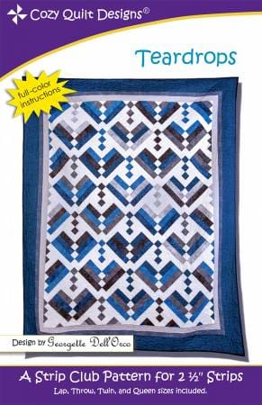 A blue and white quilt with a yellow border