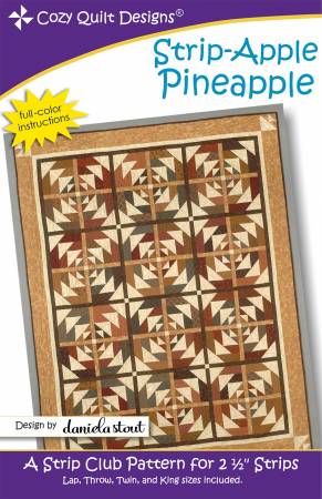 A quilt pattern with brown and tan designs.