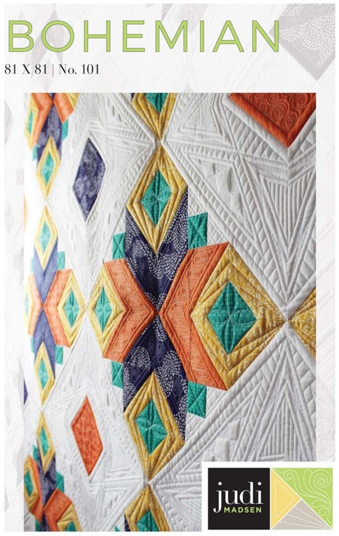 A close up of the quilt pattern on a white background