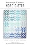 A blue and white rug with a pattern of stars.