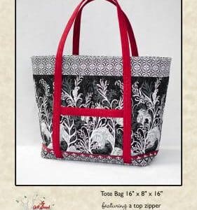 A black and white bag with red handles