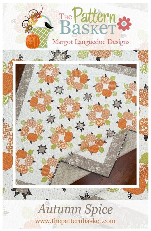 A quilt with flowers and leaves on it.
