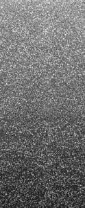 A black and white photo of some sort of speckled background.