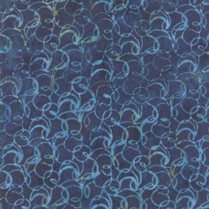 Close-up of a blue fabric with intricate swirling patterns.