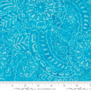 Blue fabric with intricate floral and paisley patterns.