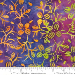 Colorful floral fabric with intricate embroidery on a purple background.