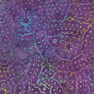 Close-up of purple fabric with intricate multicolored floral and swirl patterns