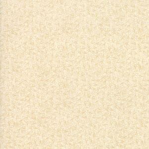 A textured beige surface with subtle speckles.