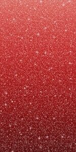 A close-up view of red glitter with sparkling particles.