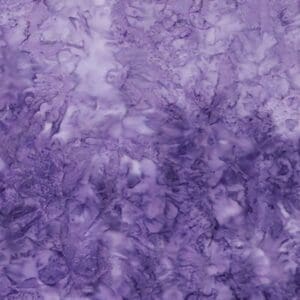 Close-up of a textured purple fabric with a floral pattern.