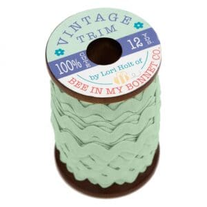 Vintage green lace trim on a spool.