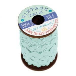 A roll of light blue adhesive fabric patches.