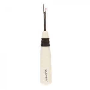 A white-handled seam ripper with a metal tip and black grip.