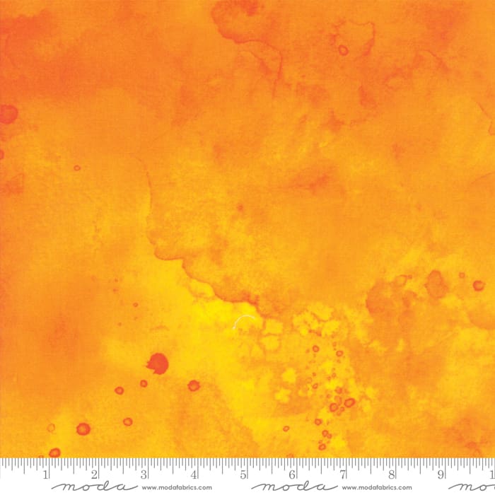 Orange and yellow watercolor texture with ruler.