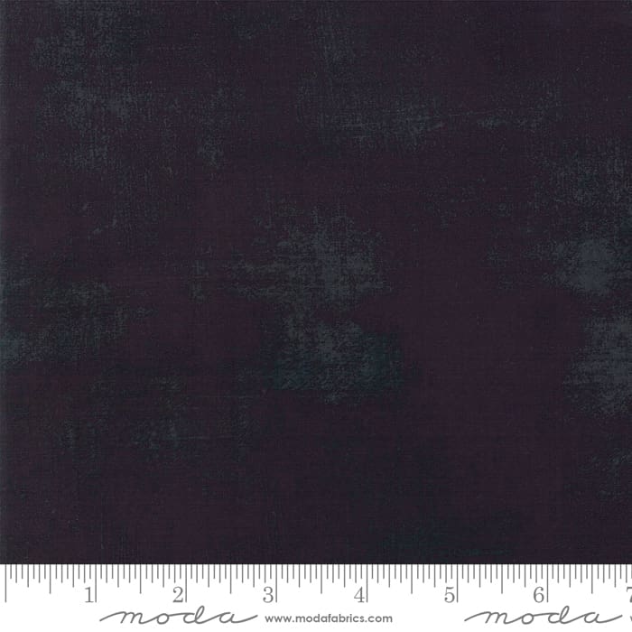 Dark textured fabric with measuring guide.