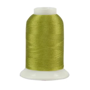 Green thread spool on white background.
