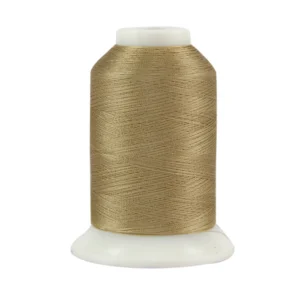 Gold thread spool on white base.